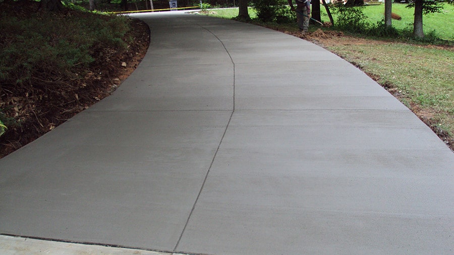 Newly paved driveway replacement curving to the street